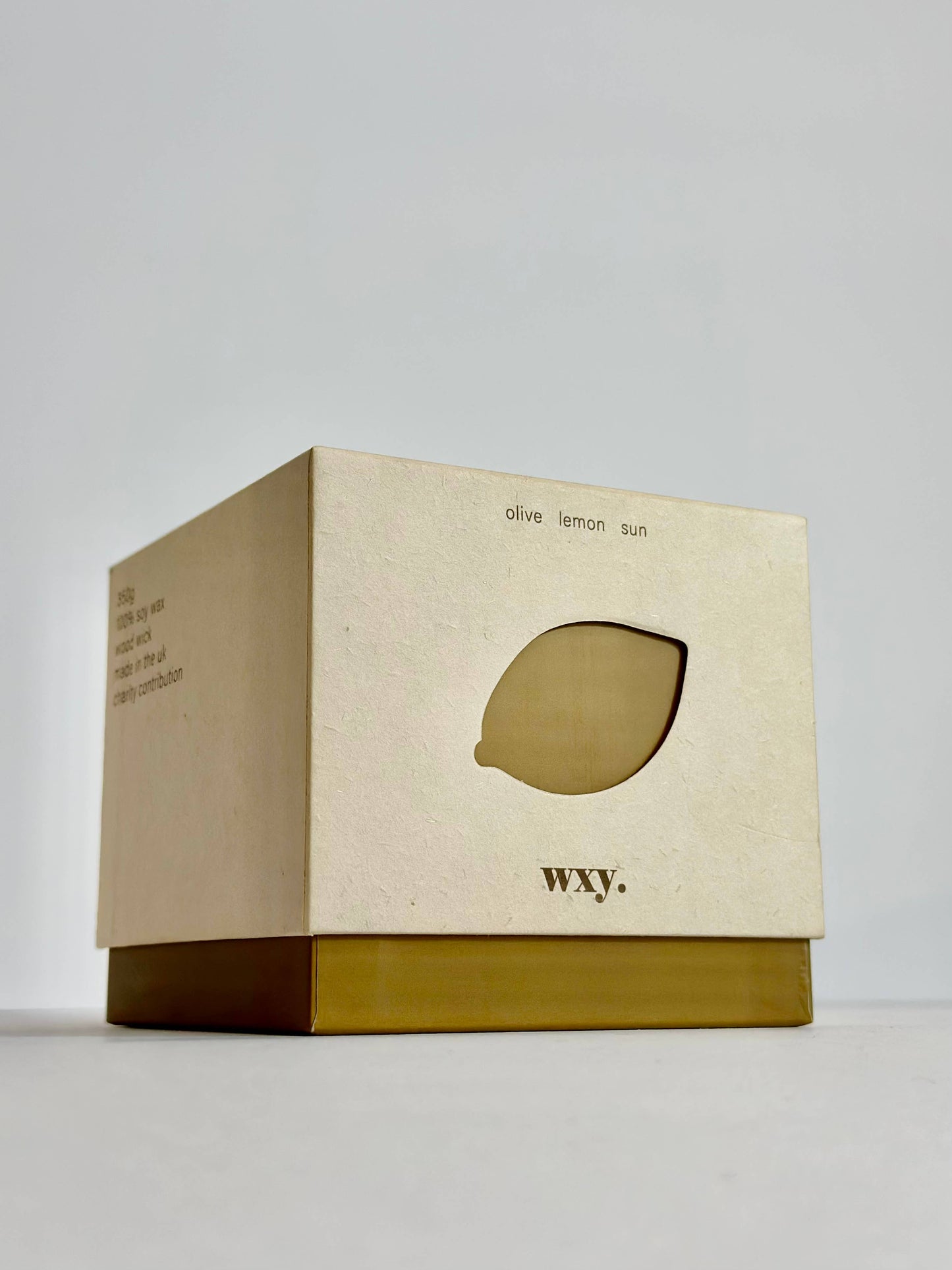 wxy. - Roam. - 12.5oz candle - olive. lemon. sun.